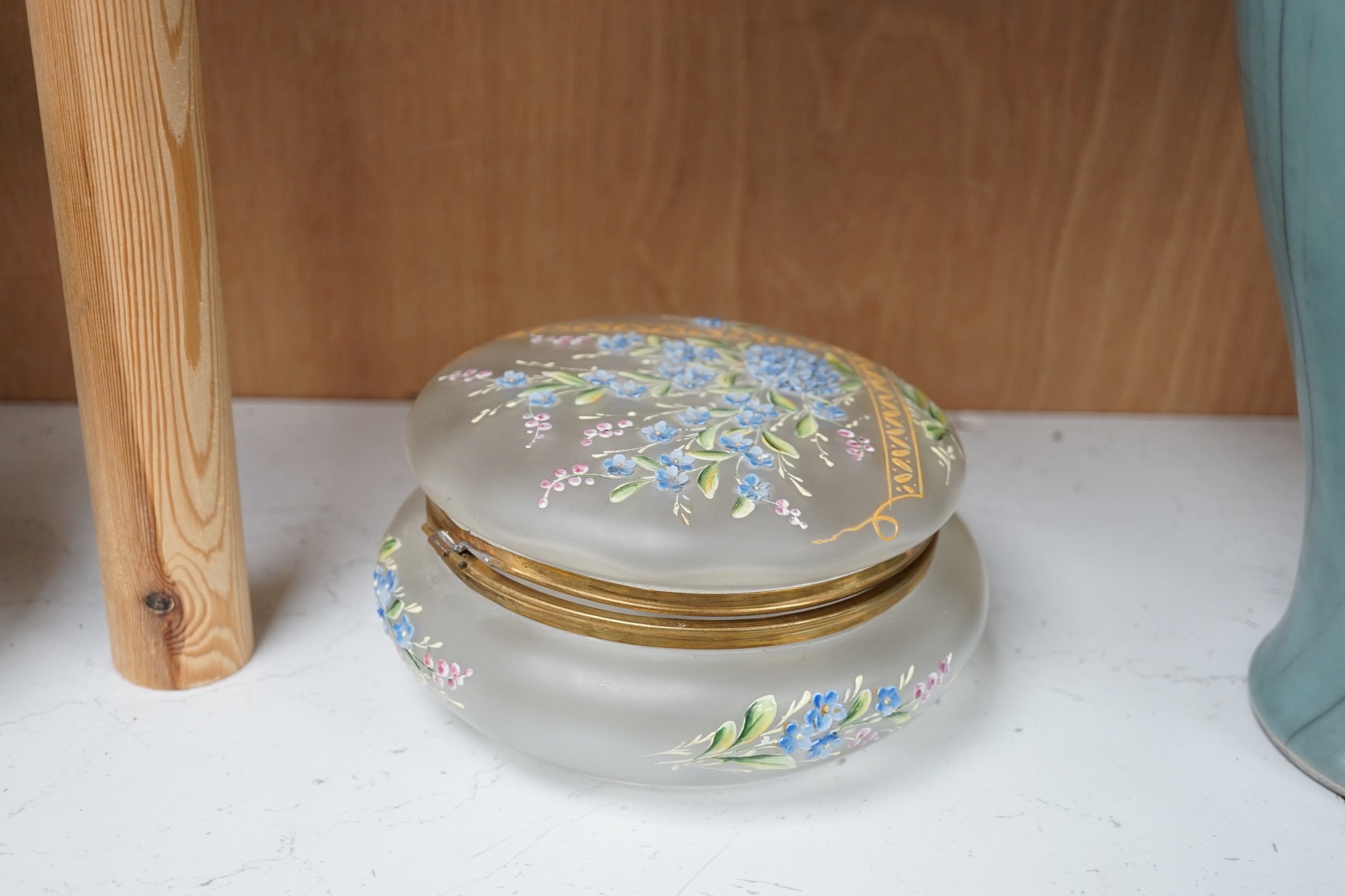 A Bohemian forget-me-not enamelled glass box and cover 18cm diameter. Condition - poor to fair, hinge broken.